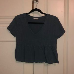 Blue cropped shirt with ruffles on the bottom. From Pacsun Small.